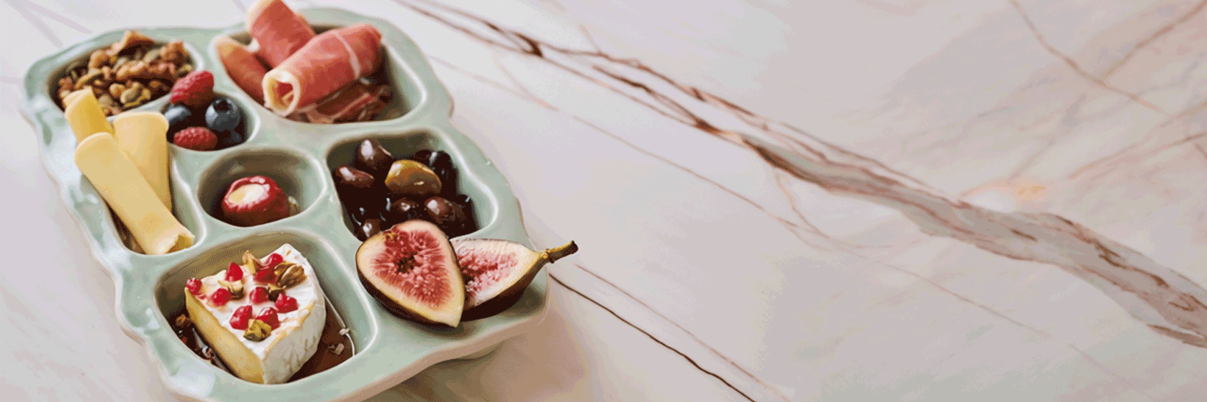 Selvedge snack plate filled with a girl dinner spread on marble