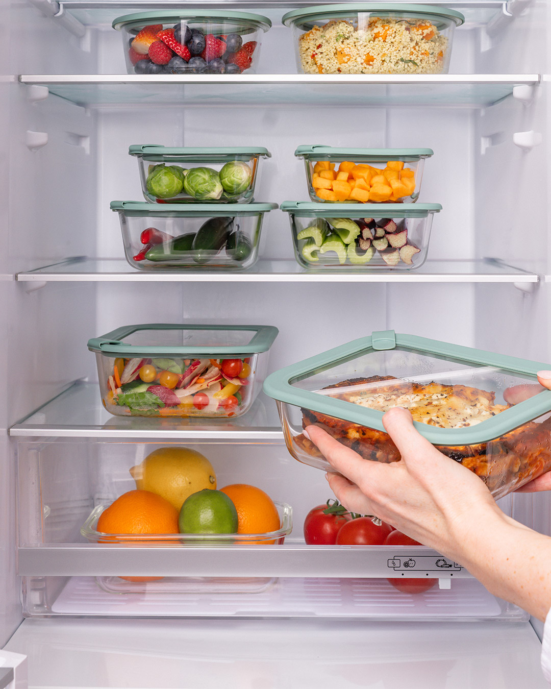 A fridge neatly stacked with Store Meal Prep containers