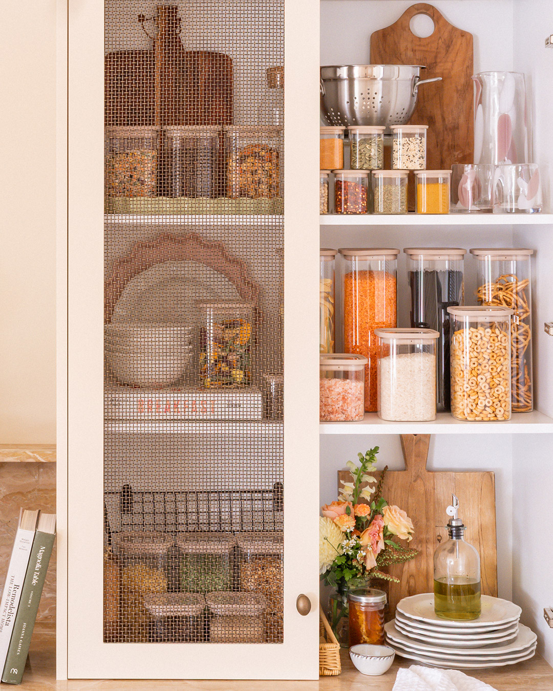 Reaching for a Store canister in a styled pantry